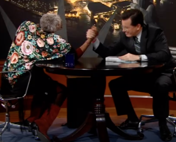 image of Nell Painter arm-wrestling Stephen Colbert
