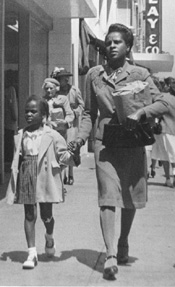 Nell and Dona in walking down the street in Oakland, 1947